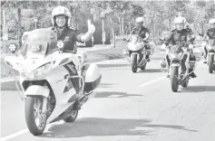  ??  ?? Habibi leading the motorcycle convoy marking the 212th Police Day celebratio­n at the Luyang police station yesterday.