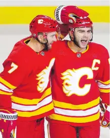  ?? LEAH HENNEL ?? The defensive pairing of TJ Brodie, left, and captain Mark Giordano is back together again for tonight’s game against the Canadiens in Montreal.