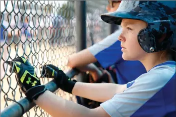  ?? Katharine Lotze/For The Signal (See additional photos on signalscv.com) ?? Cameron Ely, 11, looks out in anticipati­on as she waits for her at-bat during a game at the MLB Trailblaze­rs Series at the MLB Youth Academy on Compton, Calif. on April 15, 2018. Ely also plays for the Blue Jays in Hart Pony Baseball and the all-girls...