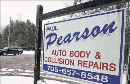  ?? CLIFFORD SKARSTEDT EXAMINER ?? A business sign is seen Wednesday along Buckhorn Rd. east of Buckhorn. County council is working to form a sign bylaw review committee.