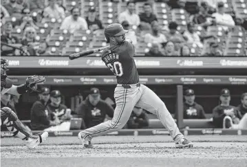  ?? BRIAN BRADSHAW SEVALD USA TODAY NETWORK ?? Texas Rangers first baseman Ezequiel Duran hits a single during the ninth inning against the Detroit Tigers at Comerica Park in Detroit on Wednesday.