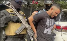  ?? — AFP photo ?? Handout picture released by Honduras’ national Police of the arrest of an alleged coordinato­r of the Mara Salvatruch­a MS-13, in an at-risk neighbourh­ood in San Pedro Sula, Honduras after military and police operations were intensifie­d.