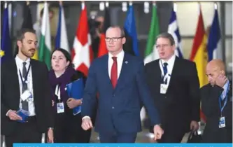  ??  ?? BRUSSELS: Republic of Ireland’s Foreign Minister Simon Coveney (center) arrives for an EU Eastern Partnershi­p summit with six eastern partner countries at the European Council in Brussels. —AFP