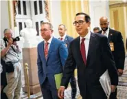  ?? NEW YORK TIMES PHOTO BY ERIN SCHAFF ?? Mick Mulvaney, left, the acting White House chief of staff, and Steven Mnuchin, the Treasury secretary, leave a meeting with congressio­nal leaders about the budget in May. The White House and Congress reached a budget deal Monday.