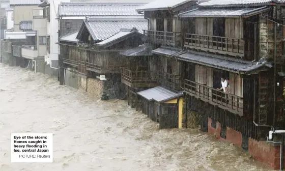  ?? PICTURE: Reuters ?? Eye of the storm: Homes caught in heavy flooding in Ise, central Japan