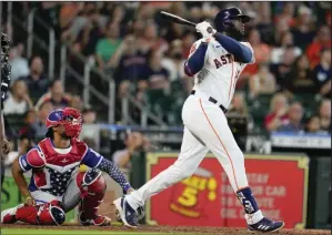  ?? (AP/Eric Christian Smith) ?? Houston Astros designated hitter Yordan Alvarez watches his walk-off home run in Monday’s 7-6 victory against the Kansas City Royals in Houston. The Astros have won seven in a row.