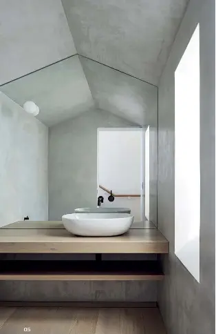  ??  ?? 05 Spaces are configured around a new central stair that, on the first floor, is flanked by the powder room and the kitchen.