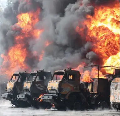  ?? Picture: AP Photo ?? Vehicles are set ablaze at an oil depot after missiles struck the facility in an area controlled by Russian-backed separatist forces in Makiivka, 150 km (94 miles) east of Donetsk, eastern Ukraine
