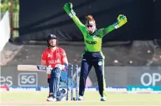  ?? — AFP photo ?? England’s Knight (left) reacts after being bowled by Ireland’s Cara Murray (not seen) as Ireland’s Mary Waldron (right) reacts during the Group B T20 women’s World Cup cricket match at Boland Park in Paarl.