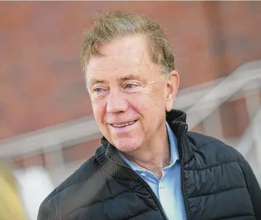  ?? Tyler Sizemore/Hearst Connecticu­t Media file photo ?? Gov. Ned Lamont campaigns with fellow Democrats in Greenwich on Election Day on Nov. 8. Connecticu­t’s projected budget surplus exceeds $3 billion as tax receipts increase.