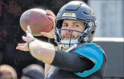  ?? AP PHOTO ?? Jacksonvil­le Jaguars quarterbac­k Blake Bortles warms up before the start of Sunday’s NFL wild-card playoff football game against the Buffalo Bills in Jacksonvil­le, Fla.