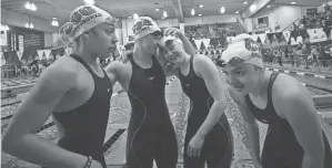  ?? LORRIE CECIL/THISWEEK NEWSPAPERS ?? CSG swimmers, from left, Nyah Funderburk­e, Ava Fortney, Olivia Morse and Bethany Spangler celebrate their win in the 200 medley relay at the Division II girls state meet on Wednesday in Canton.