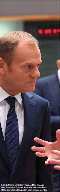  ??  ?? British Prime Minister Theresa May speaks with European Council President Donald Tusk at the European Council in Brussels yesterday