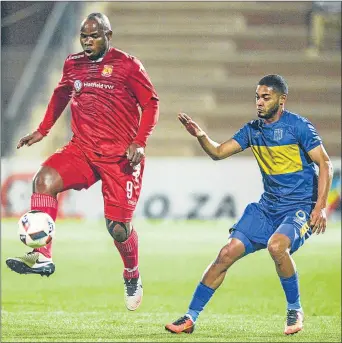  ?? Picture: GALLO IMAGES ?? REACHING MILESTONE: Highlands Park striker Collins Mbesuma, left, and Ebrahim Seedat of Cape Town City in action during their league match at Makhulong Stadium in Johannesbu­rg on Tuesday