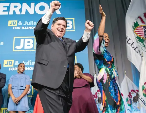  ?? ASHLEE REZIN/SUN-TIMES ?? Democrat J.B. Pritzker and running mate Juliana Stratton celebrate Tuesday at an election night rally at the Marriott Marquis Chicago.