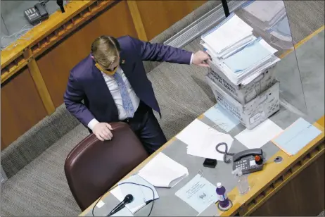  ?? LUIS SÁNCHEZ SATURNO/The New Mexican ?? Sen. Cliff Pirtle, R-Roswell, stands next to a stack of potential amendments Friday in preparatio­n for a floor debate.