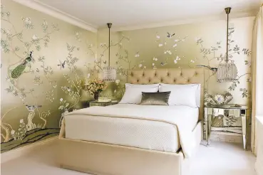  ?? ANTOINE BOOTZ/CRAIG & COMPANY VIA AP ?? Designer Joan Craig used a hand-painted Chinoiseri­e silk wallpaper from de Gournay in this bedroom. ‘Wallpaper is having its day,’ says Craig. ‘We can’t get enough of it and neither can our clients.’