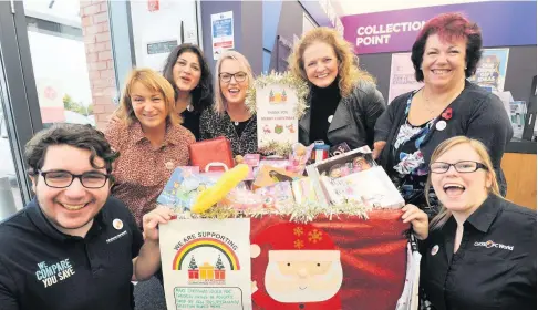  ??  ?? Saving Christmas
Launch of the South Ayrshire Toy Bank. Volunteers are pictured with staff members of Currys PC World which was a drop off point