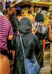  ?? PTI ?? DARING ACT: Bindu and Kanaka Durga (in black outfits) walk to offer prayers at the Sabarimala temple. —