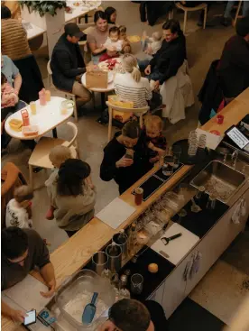  ?? Photograph: Grant Harder/The Guardian ?? Parents attend a ‘baby happy hour’ at Please Beverage Co in Vancouver on 19 December 2023.