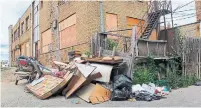  ?? JACK LAKEY ?? Illegal dumping has resumed in the alley behind the Knob Hill Plaza on Eglinton Ave. E. in Scarboroug­h.