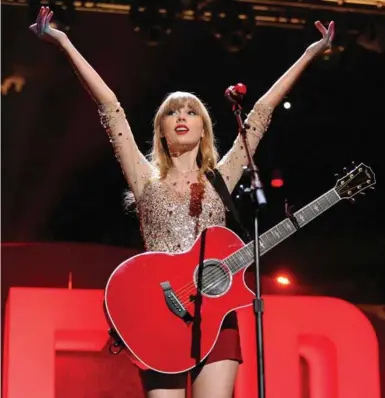  ?? EVAN AGOSTINI/INVISION/THE ASSOCIATED PRESS ?? More women are playing guitar these days, which Fender CEO Andy Mooney largely credits to singer-songwriter Taylor Swift.