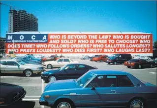  ?? Gene Ogami MOCA ?? REPRISING Barbara Kruger’s “Untitled (Questions),” which appeared on what’s now the Geffen Contempora­ry in 1990, was one of the first things Biesenbach did as director at MOCA.