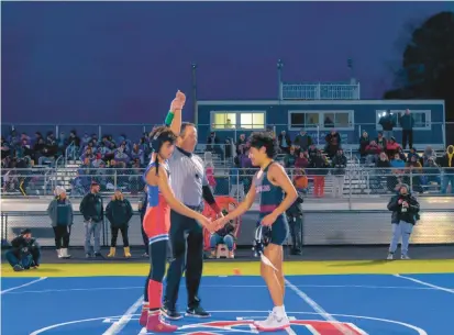  ?? KARL MERTON FERRON/STAFF ?? Old Mill’s Logan Johnson, left, gets his hand raised after beating Annapolis’ Parker Joebchen in the 113-pount match during Thursday’s dual.