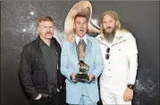  ?? NICHOLAS HUNT / GETTY IMAGES FOR NARAS ?? Brann Dailor, Bill Kelliher and Troy Sanders of Mastodon pose backstage with the award for best metal performanc­e for “Sultan’s Curse” at the Premiere Ceremony during the 60th Annual Grammy Awards on Jan. 28 in New York City.