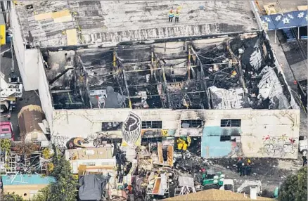  ?? Jay L. Clendenin Los Angeles Times ?? THE DEATH TOLL of the Oakland warehouse fire rose Monday to 36 as officials faced growing scrutiny over past complaints about the building. “We recognize people deserve answers,” Mayor Libby Schaaf said in response to the questions about safety...