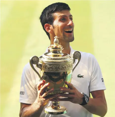  ?? Getty ?? Novak Djokovic secured his 13th grand slam title when he beat Kevin Anderson in straight sets at Wimbledon on Sunday