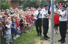  ?? STAFF FILE PHOTO ?? Members of the Chattanoog­a Vietnam Veterans of America 203, from left, Robert Bunch, Denney Miller and Stan Brown, raise the flag at Falling Water Elementary School on Sept. 11, 2008.