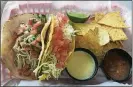  ?? PHOTO BY LIGAYA FIGUERAS ?? Ronaldo’s Resto Bar offers tacos with housemade tortillas, salsa and queso.