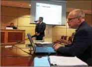  ?? EVAN BRANDT — DIGITAL FIRST MEDIA ?? Scott Zukin, vice president of Zukin Realty Inc., foreground, and Jon Cohn, chief operating officer for Keystone Cannabis LLC, prepare to address borough council Wednesday night.