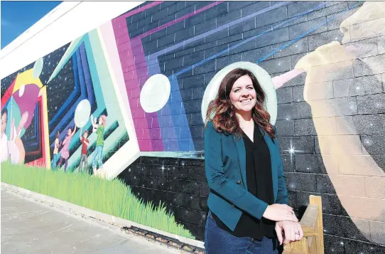  ?? MICHELLE BERG ?? DeeAnn Mercier, executive director of the Broadway Business Improvemen­t District, says one of the ways the organizati­on has been addressing the increase in graffiti is by creating murals in the area, which discourage­s vandalism.