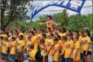  ?? MARIAN DENNIS – DIGITAL FIRST MEDIA ?? Racers stand at the finish line with Ronald McDonald before beginning a day of racing down Wilson Street for the annual Soap Box Derby Challenge race.