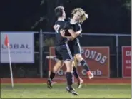  ??  ?? Boyertown’s Landon Wenger, right, celebrates with Nick Willson (17) after scoring a goal in the second half against Owen J. Roberts.