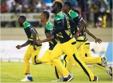  ?? GETTY IMAGES ?? Members of the Jamaica Tallawahs team run on to the field in celebratio­n after beating the St Lucia Stars during Match 14 of the 2017 Hero Caribbean Premier League at the Darren Sammy Stadium in Gros Islet, Saint Lucia, on Tuesday night.