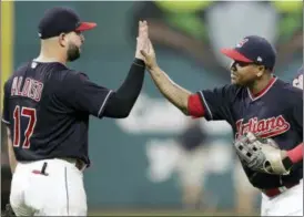  ?? TONY DEJAK— ASSOCIATED PRESS ?? Indians’ Yonder Alonso, left, celebrates with Jose Ramirez after the Indians defeated the Minnesota Twins 8-1 in a game on Aug. 28 in Cleveland.