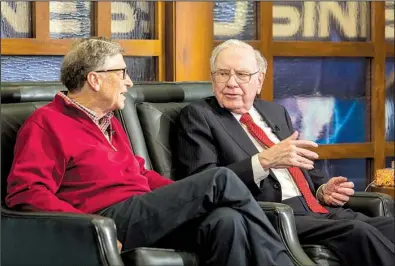  ?? AP/ JOHN PETERSON ?? Microsoft co- founder and Berkshire board member Bill Gates ( left), and Berkshire Hathaway Chairman and CEO Warren Buffett speak Monday in Omaha, Neb., during an interview for the Fox Business Network.
