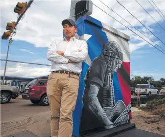  ?? Mark Mulligan / Houston Chronicle ?? Chris Hotze, founder of Crescere Capital Management, commission­ed street artist w3r3on3 to paint this mural of Willie Nelson near one of his firm’s projects at the intersecti­on of 34th and Ella streets.