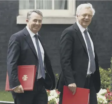  ?? PICTURE: GETTY IMAGES ?? Liam Fox and David Davis leave 10 Downing Street after Cabinet meetings