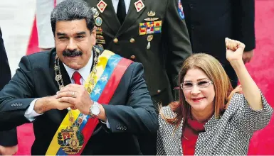  ??  ?? FEDERICO PARRA / AFP / GETTY IMAGES Venezuelan President Nicolas Maduro and his wife Cilia Flores, who has been described as her husband’s “strong arm.”