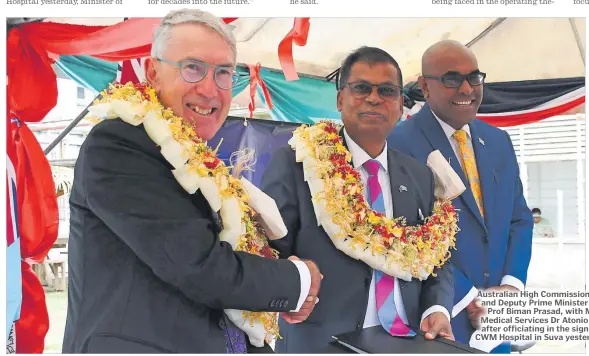  ?? Picture: JONA KONATACI ?? Australian High Commission­er to Fiji Ewen McDonald and Deputy Prime Minister and Minister of Finance Prof Biman Prasad, with Minister for Health and Medical Services Dr Atonio Lalabalavu shake hands after officiatin­g in the signing of direct funding for CWM Hospital in Suva yesterday.
