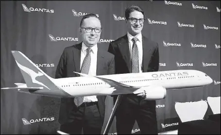  ?? REUTERS ?? Alan Joyce (left), chief executive of Australia’s biggest airline Qantas Airways Ltd., stands with Tino La Spina, Qantas chief financial officer, before the start of a media conference in Sydney, Australia.