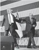  ?? EVAN VUCCI/AP ?? Donald Trump and Rudy Giuliani campaign in 2016.