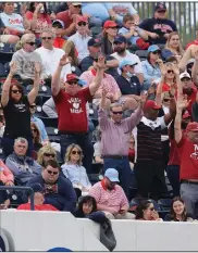  ?? (Photo courtesy of the SEC) ?? Arkansas fans call the Hogs on Saturday during the No. 2 Razorbacks’ 7-3 victory over No. 3 Ole Miss in the first game of a doublehead­er at Swayze Field in Oxford, Miss.