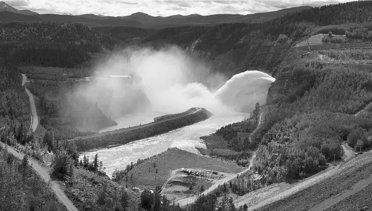  ?? SUPPLIED ?? “Excess” water, which authors Amy Sopinka and Tom Pedersen describe as potential energy never to be generated, is spilled over the W. A.C. Bennett Dam in northern British Columbia.