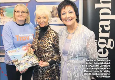  ?? PETER MORRISON ?? Debbie McGee visits the Belfast Telegraph stand. From left, Joanne Uprichard,
Marketing Manager and Maureen Ledwith, Holiday World Show Sales Director