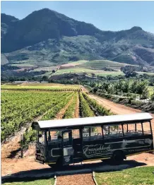 ?? COLEMAN BIANCA ?? THE Franschhoe­k Wine Tram bus ferries guests to tasting rooms and farms.|